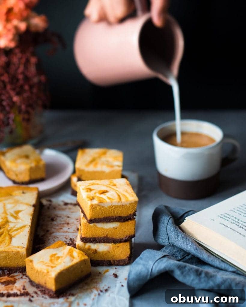 Vegan Baked Pumpkin Cheesecake Bars — Creamy Fall Dessert 6 Woman pouring milk into mug next to cheesecake bars on a table.