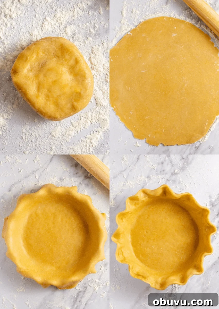 pie crust being rolled out on a floured counter.