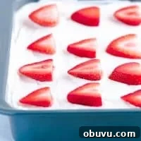 Gluten-Free Strawberry Icebox Cake Recipe for Summer Slices 8 Gluten Free Strawberry Icebox Cake in a metal 9x9 pan