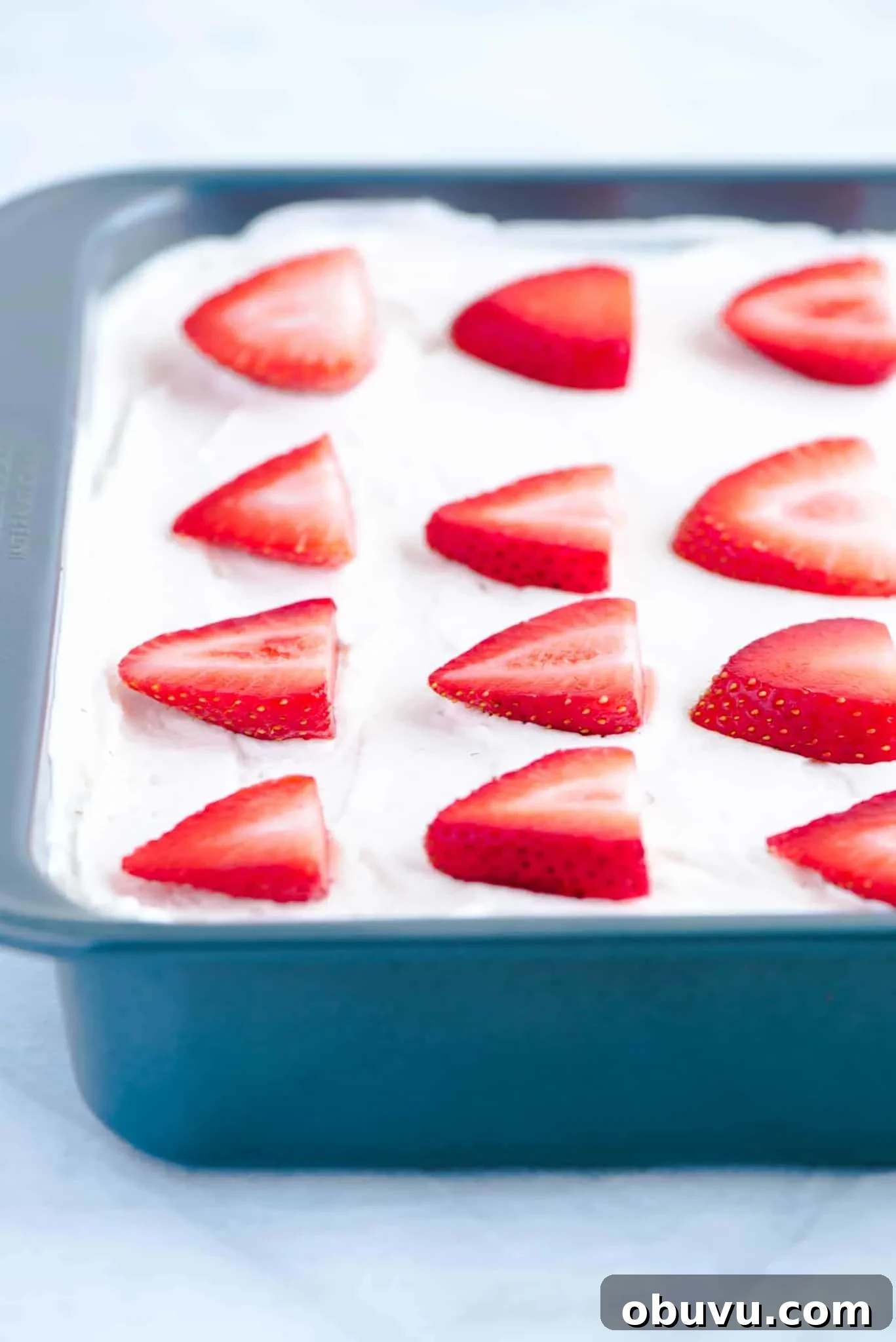 Gluten-Free Strawberry Icebox Cake Recipe for Summer Slices 4 Gluten Free Strawberry Icebox Cake in a metal 9x9 pan