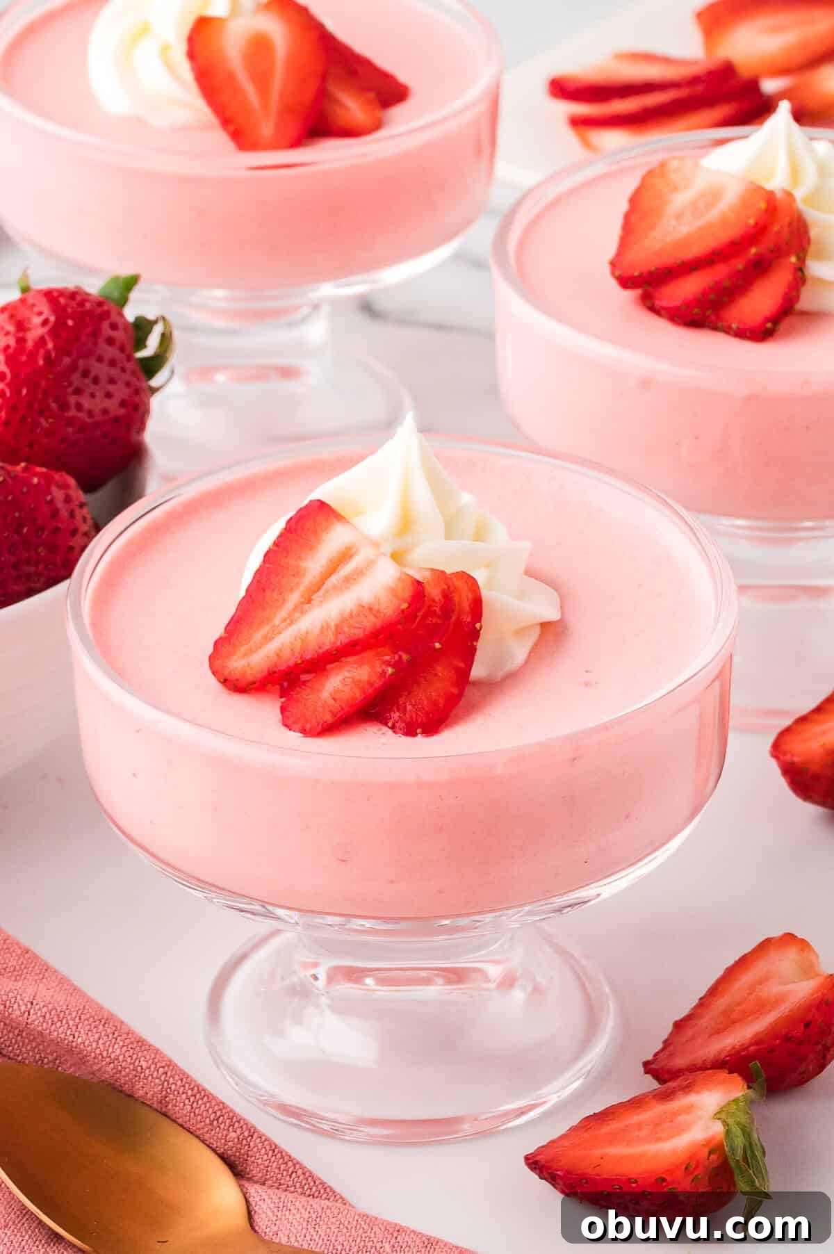 Strawberry mousse in a parfait dish.