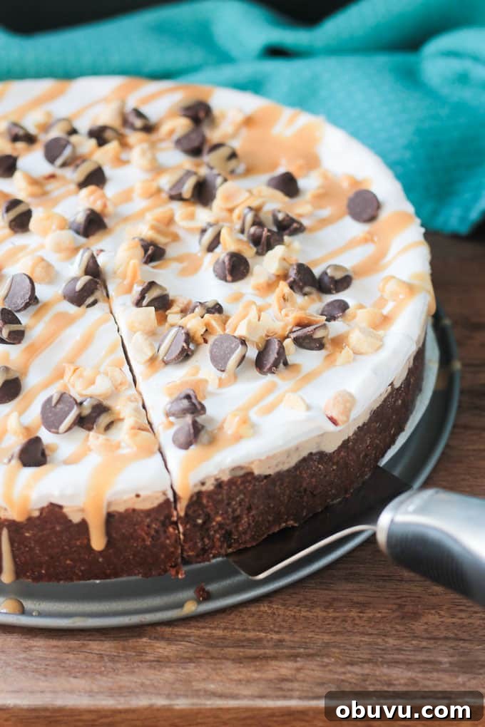 Frozen Peanut Butter Chocolate Chip Pie Frozen Chocolate chip peanut butter pie, with one slice cut, topped with chocolate chips and caramel drizzle.