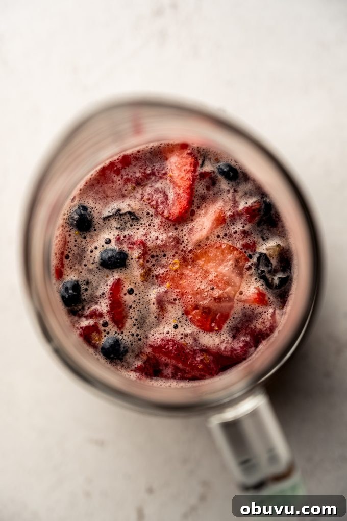 Berry Sangria and Berry Mocktail Recipes for Every Occasion 13 Aerial photo of berry sangria in a glass pitcher.