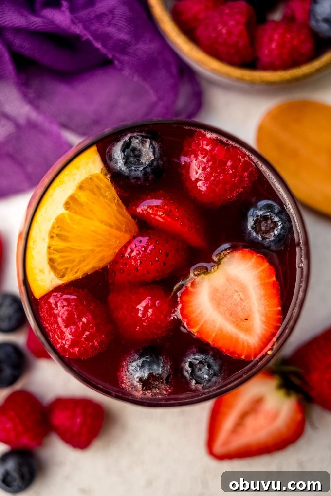 Berry Sangria and Berry Mocktail Recipes for Every Occasion 16 Aerial photo of a glass of berry sangria.