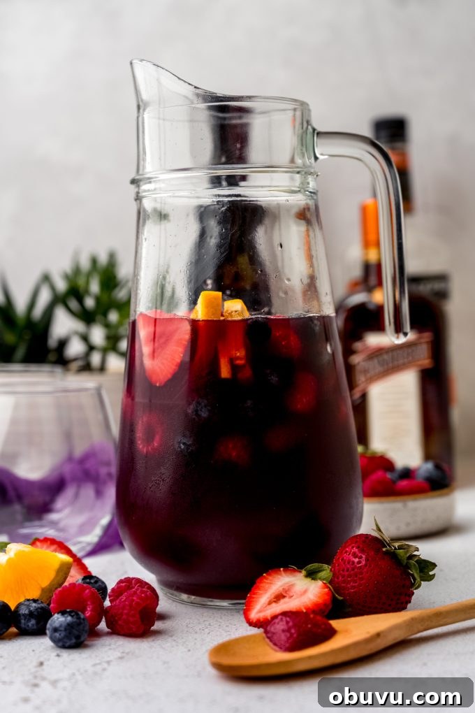 Berry Sangria and Berry Mocktail Recipes for Every Occasion 17 A glass pitcher of berry sangria.