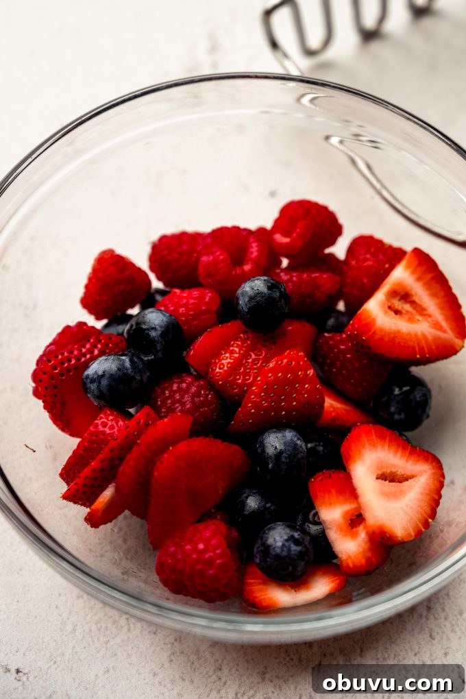 Berry Sangria and Berry Mocktail Recipes for Every Occasion 6 A bowl of blueberries, strawberries, and raspberries.