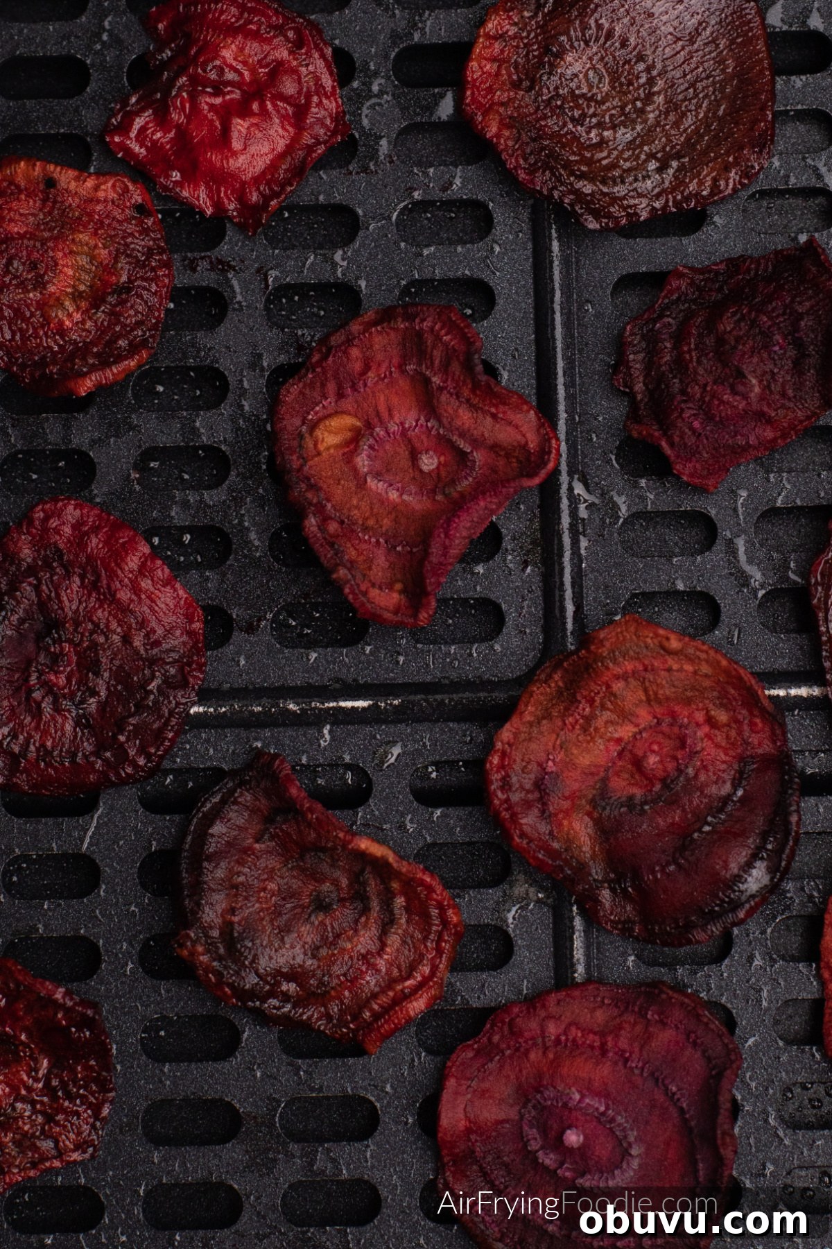Crispy Air Fryer Beet Chips Recipe: Quick Homemade Snack 7 Beet chips cooked and in the basket of the air fryer.