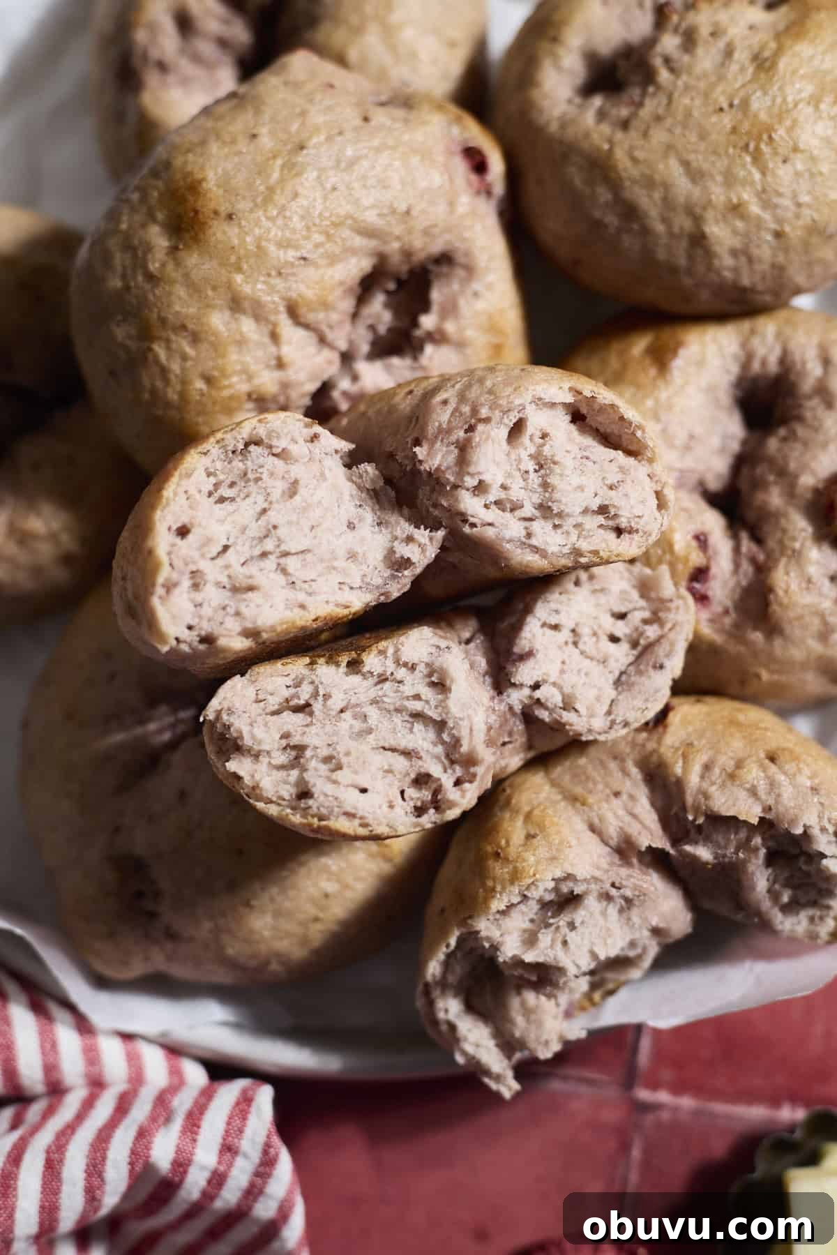 Strawberry Sourdough Discard Bagels: Soft, Tangy & Fresh 12 A bagel broken in half on a platter.