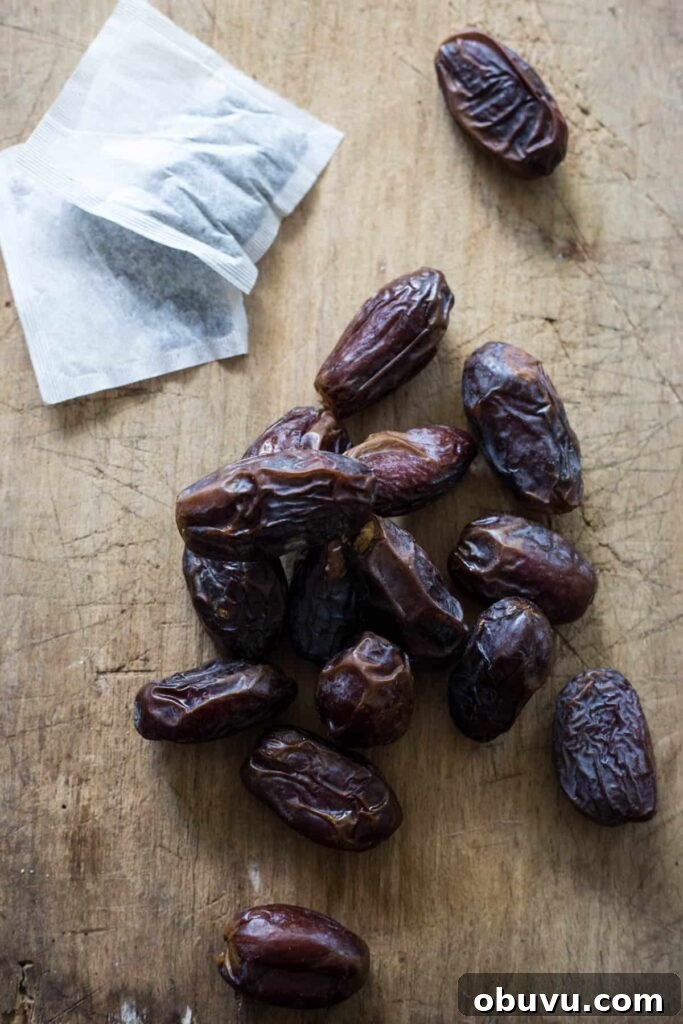 dates on a wooden board with tea bags