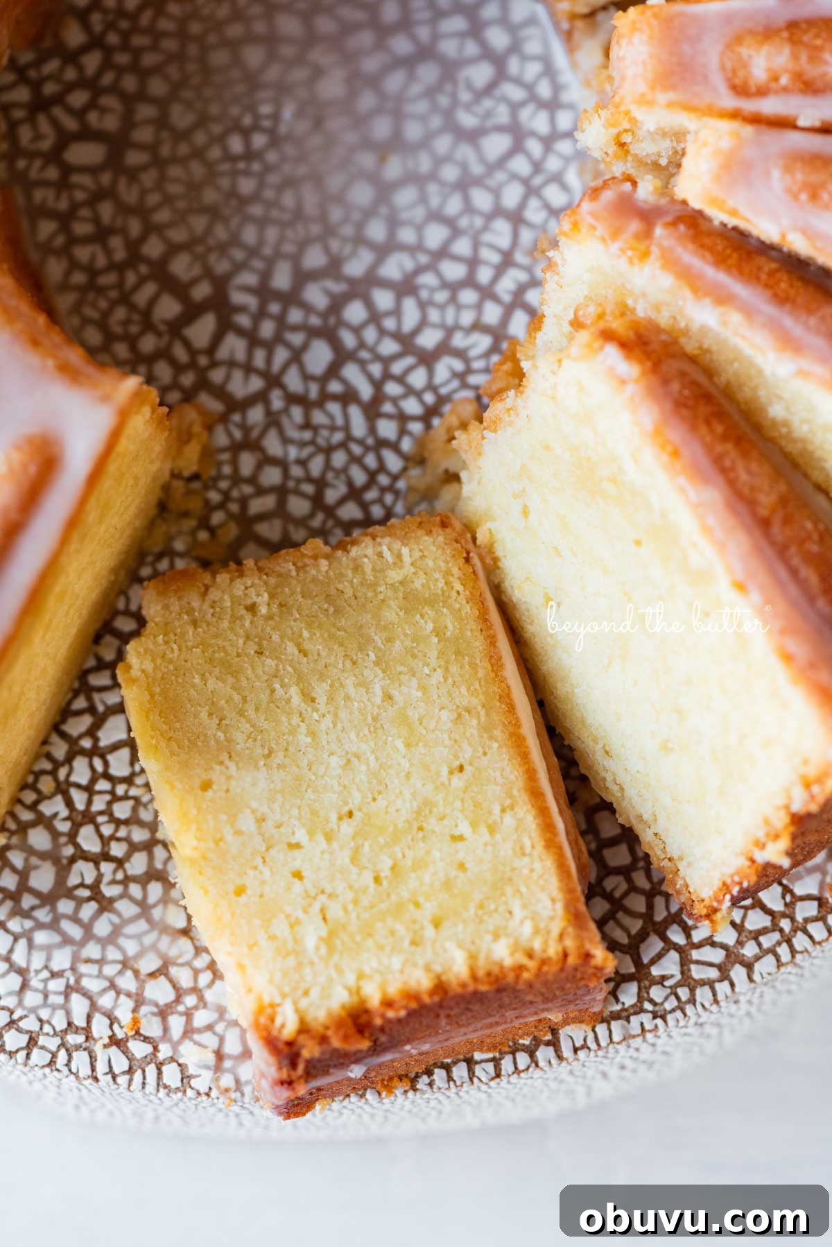 Lemon Cream Cheese Pound Cake Recipe with Zesty Glaze 8 Sliced lemon cream cheese pound cake with a lemon glaze