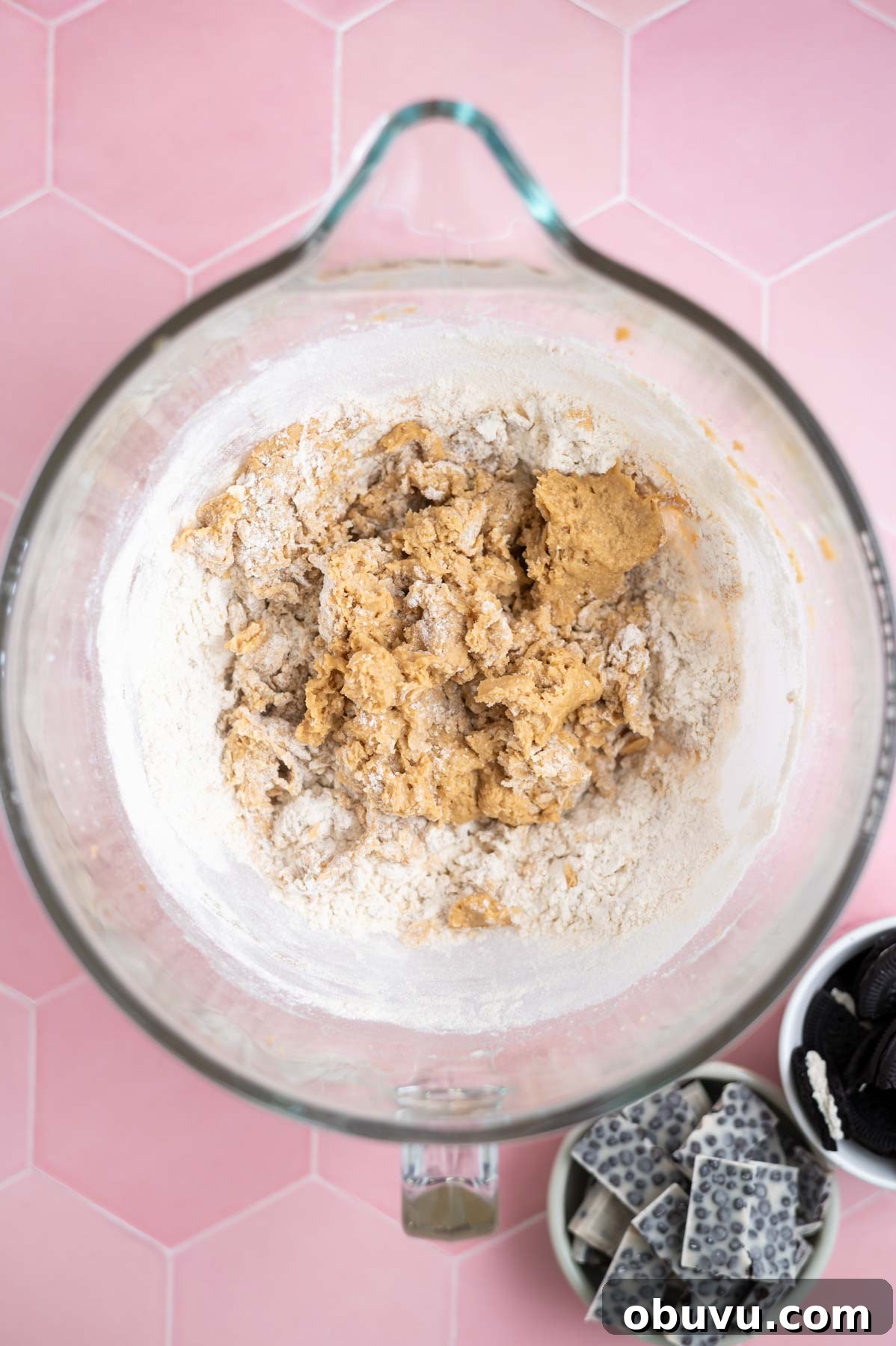 Soft Cookies and Cream Bars Recipe — Chewy & Irresistible 8 flour mostly mixed into cookie dough in a mixing bowl