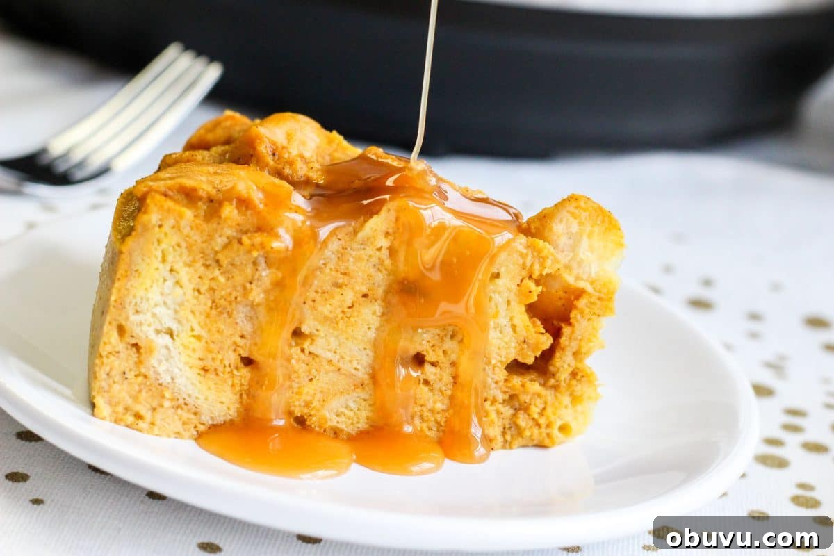 Instant Pot Pumpkin Bread Pudding with Air Fryer Crisp Option 11 A plate holding a slice of bread pudding that's being drizzled with caramel sauce - Hostess At Heart