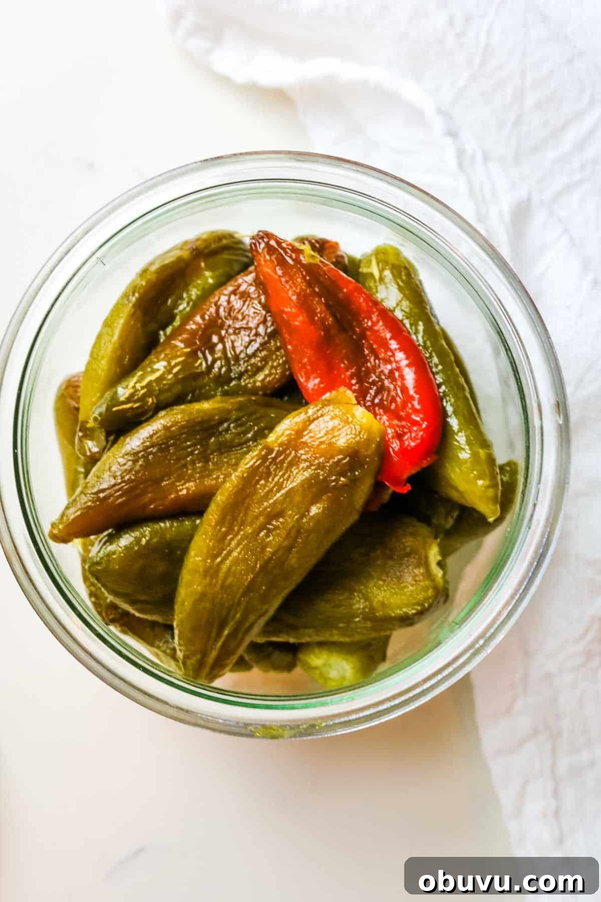 Charred Jalapeños: How to Roast and Use Smoky Peppers 2 weck jar full of roasted jalapeno peppers.