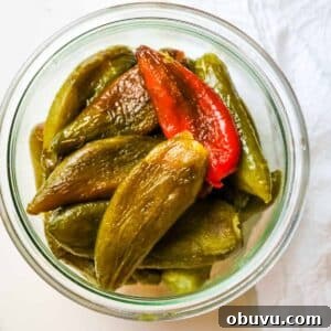 Charred Jalapeños: How to Roast and Use Smoky Peppers 13 Roasted and peeled peppers in a jar.