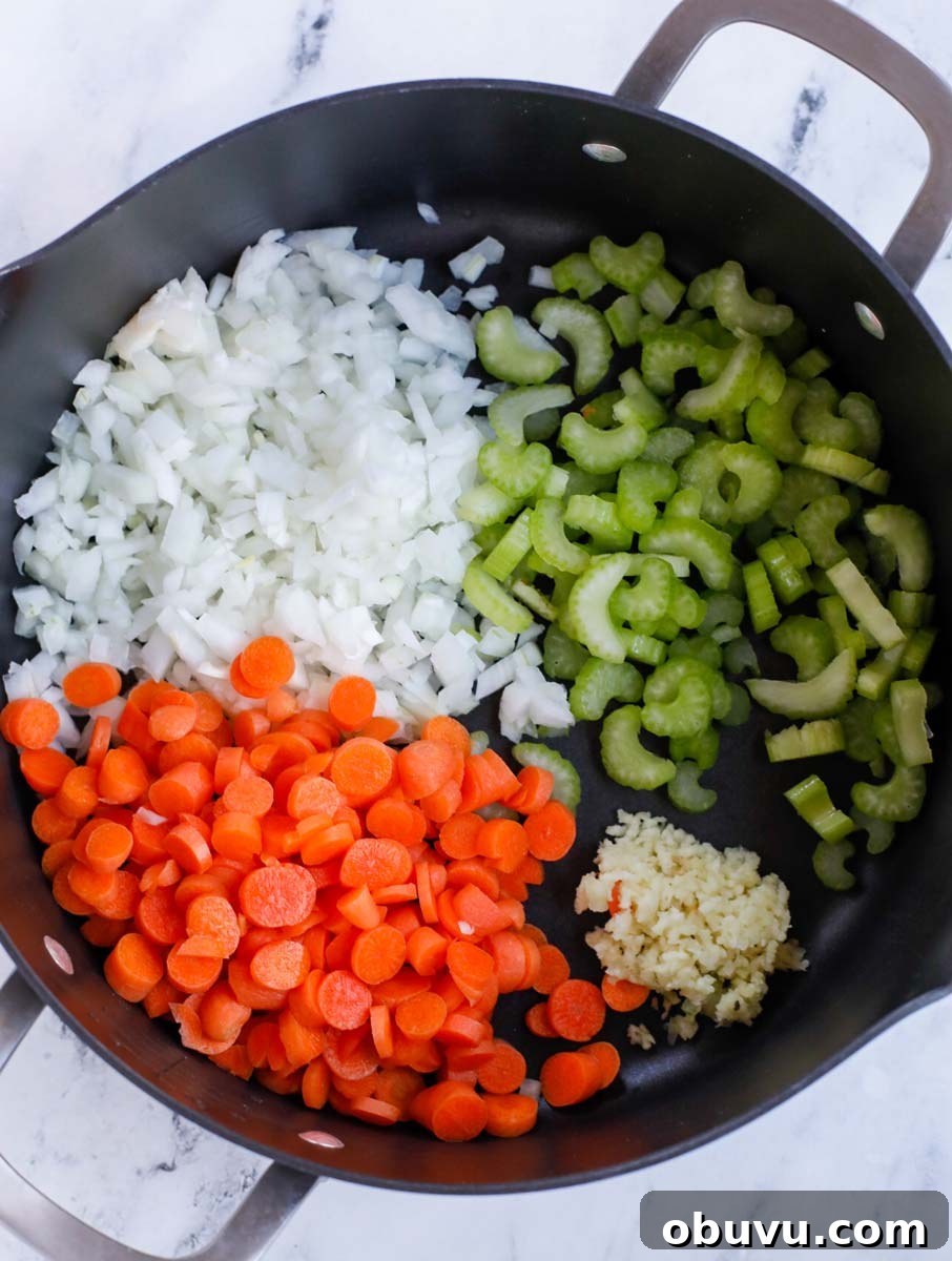 Authentic Tuscan White Bean Soup Recipe for Cozy Weeknights 4 Vegetables to be sauted in a pot.