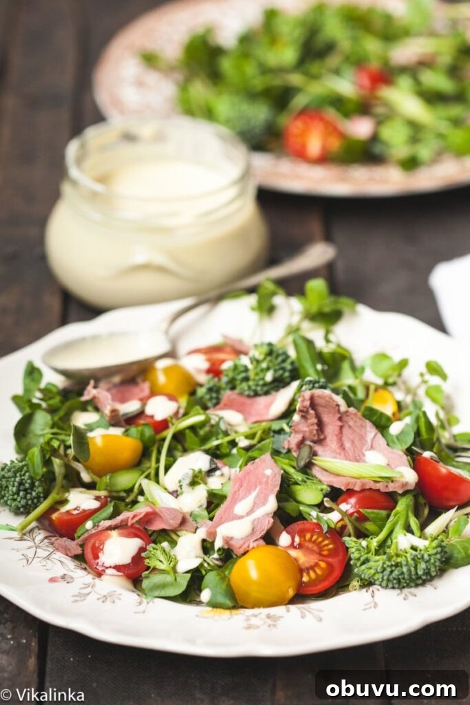 Watercress & Roast Beef Salad with Creamy Horseradish Dressing 2 plate of salad with dressing behind in a jar