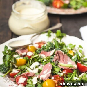Watercress & Roast Beef Salad with Creamy Horseradish Dressing 6 plate of salad with dressing behind in a jar