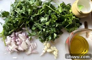 Authentic Chimichurri Sauce Recipe for Grilled Meats and Vegetables 3 Prepped herbs for chopper