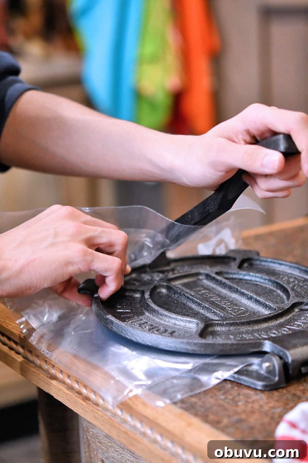 demonstration of using a cast iron tortilla press