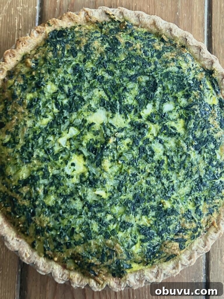 Spinach and Swiss Quiche with Frozen Pie Crust 2 Overhead view of baked spinach swiss quiche recipe.