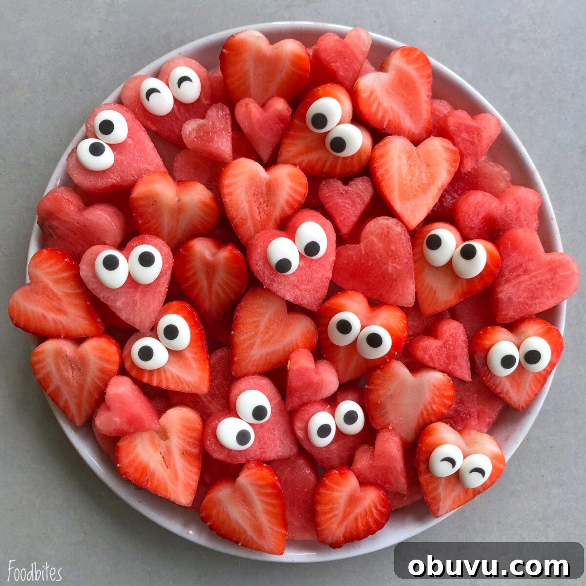 Refreshing Watermelon Fruit Salad with Mint and Lime 3 A Heart Shaped Fruit Platter features watermelon and strawberry slices cut into hearts, each topped with candy eyes.