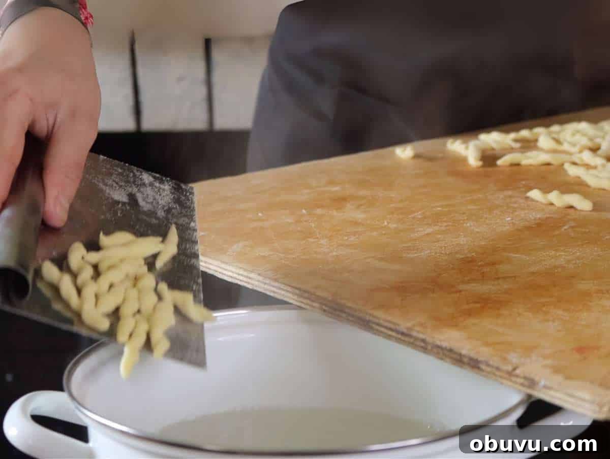 Handmade Trofie Pasta Recipe: Authentic Ligurian Method 7 Step 4 Cooking trofie pasta in boiling salted water until glossy and firm.
