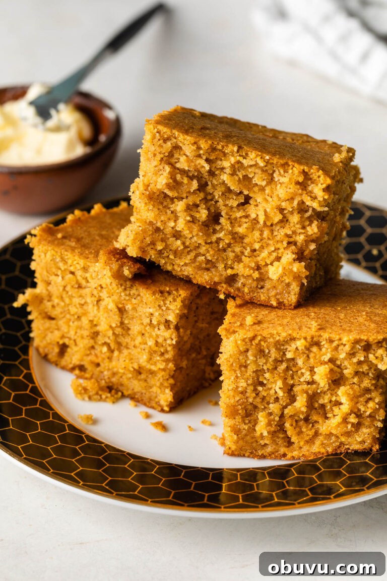 Soul Food Thanksgiving Menu 2024: 30+ Classic Recipes 31 three pieces of sweet potato cornbread stacked on a plate