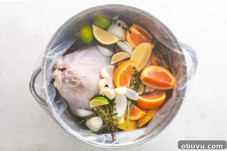 Soul Food Thanksgiving Menu 2024: 30+ Classic Recipes 6 turkey in a large pot with water, salt, sugar, limes, lemons, oranges, garlic, and thyme