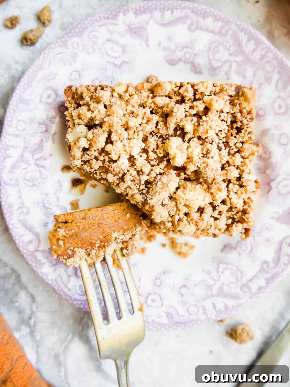 Gluten-Free Pumpkin Coffee Cake Recipe (Paleo-Friendly) 3 Paleo Pumpkin Coffee Cake with a fork in it.