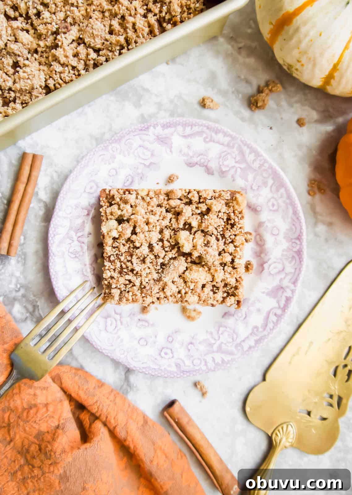 Gluten-Free Pumpkin Coffee Cake Recipe (Paleo-Friendly) 4 A slice of Gluten-free Pumpkin Coffee Cake on a plate.