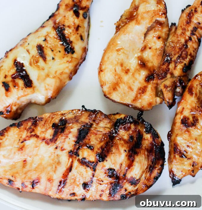 General Tso Grilled Chicken Bowls with Sesame Rice 5 grilled chicken breast on a plate.