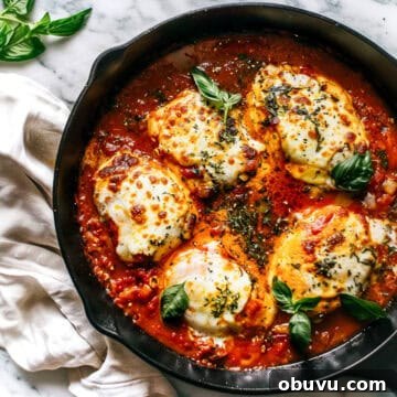 Weekly Family Meal Plan: Budget-Friendly Menu for Week 126 3 Italian chicken in tomato sauce with mozzarella and basil in a skillet.