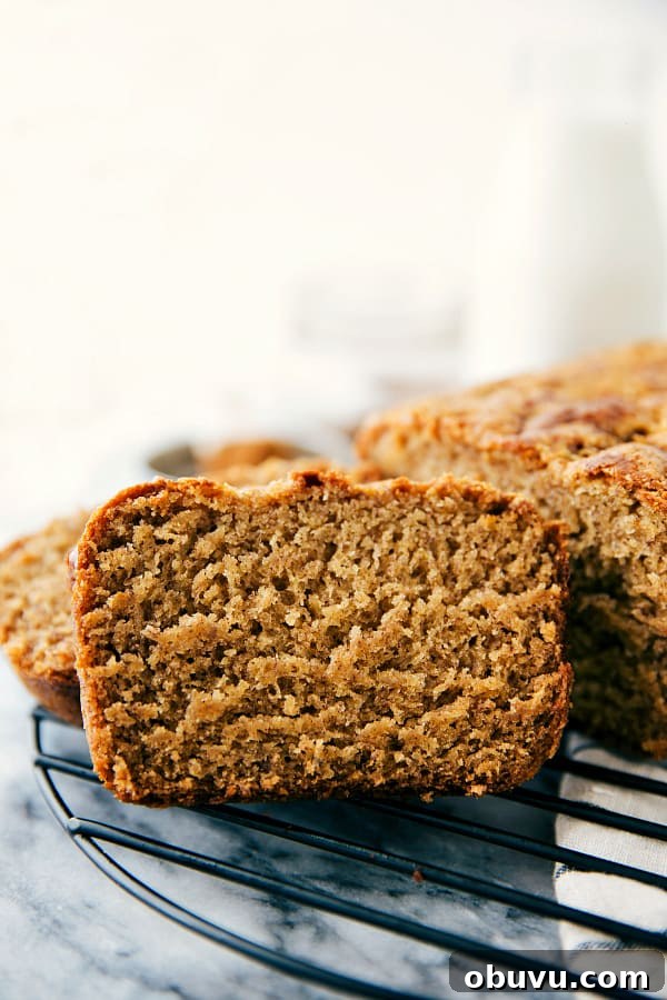 Banana cake slice on a cooling rack.
