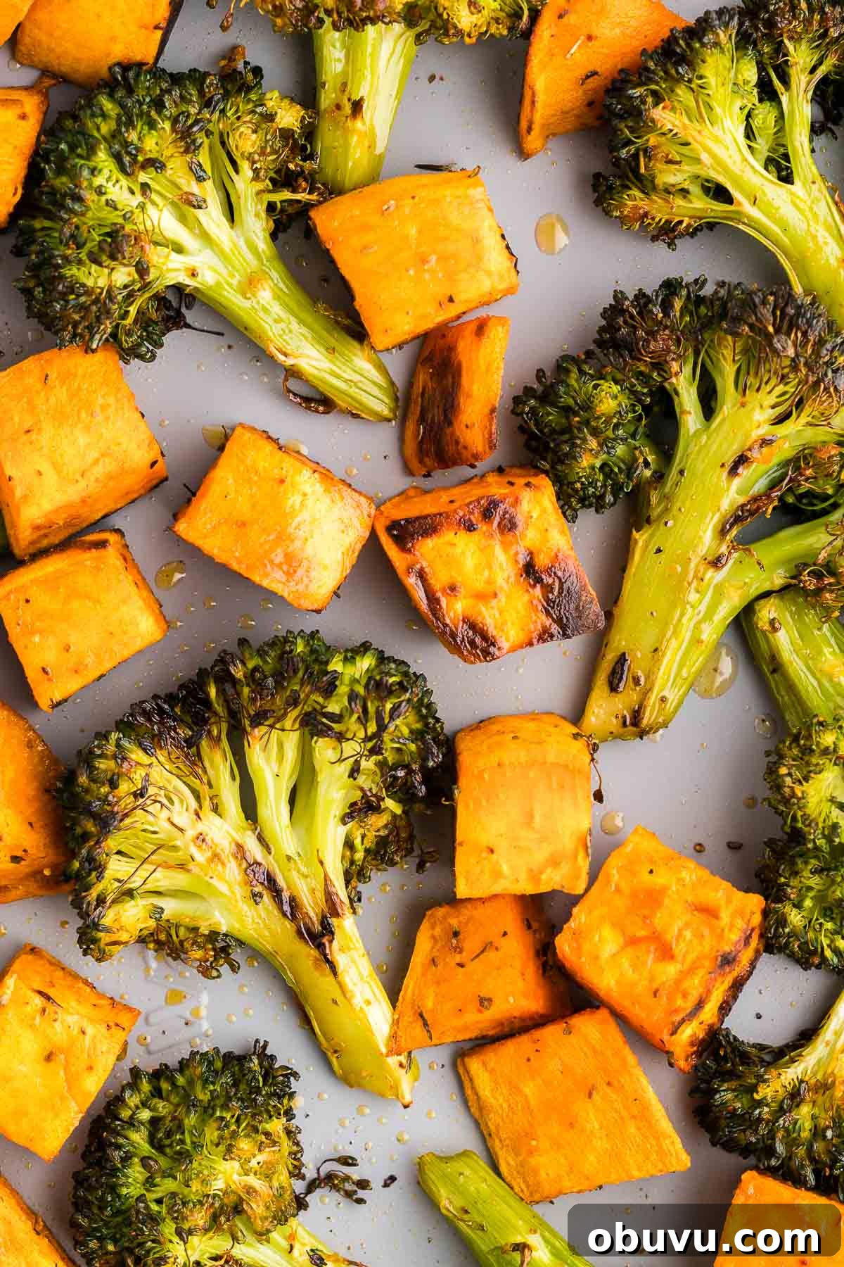 Crispy Roasted Broccoli with Maple-Sweet Potatoes 2 roasted broccoli and sweet potatoes recipe on a sheet pan
