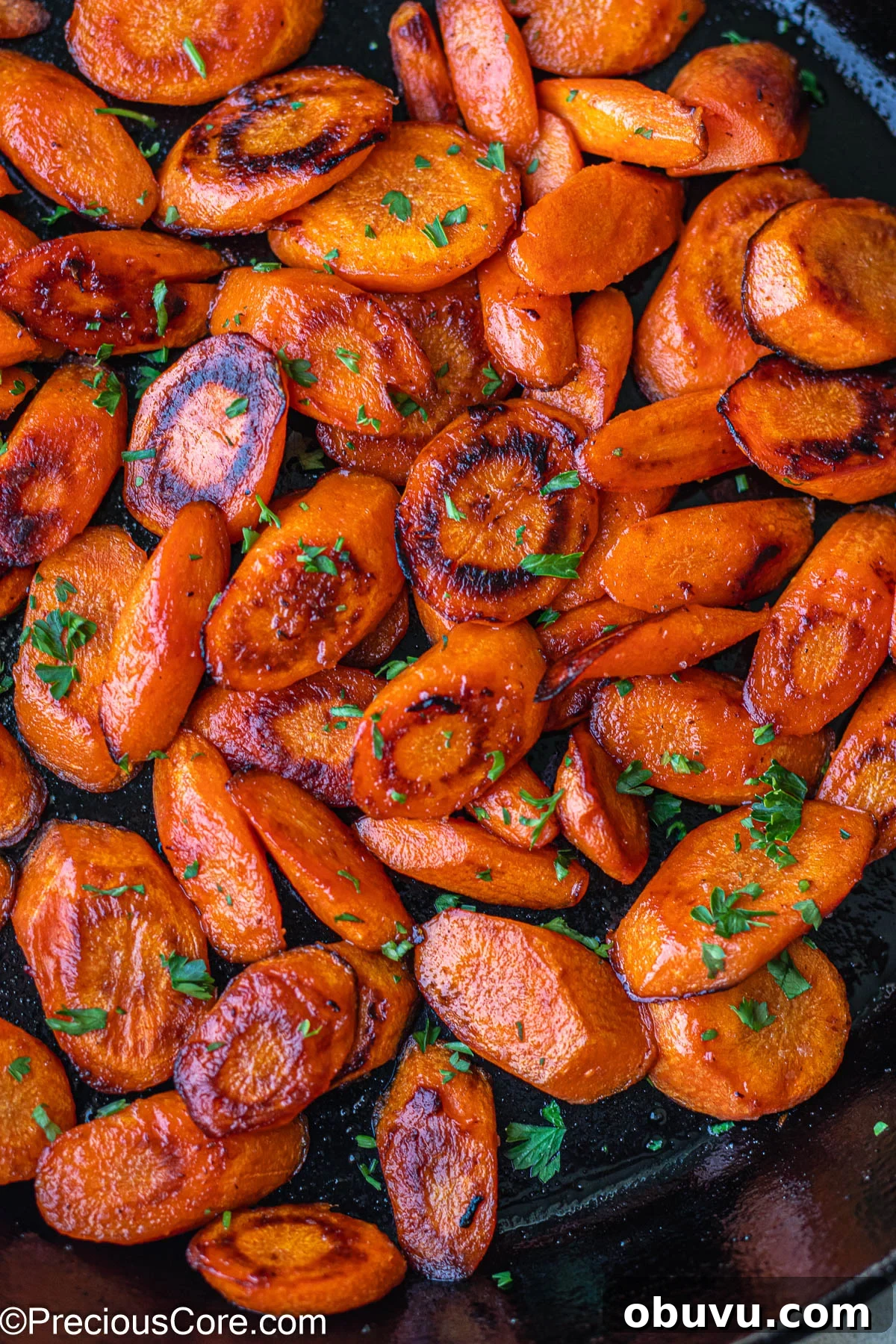 Crispy Pan-Fried Carrots with Garlic and Herbs 2 Fried Carrots in a cast iron skillet.
