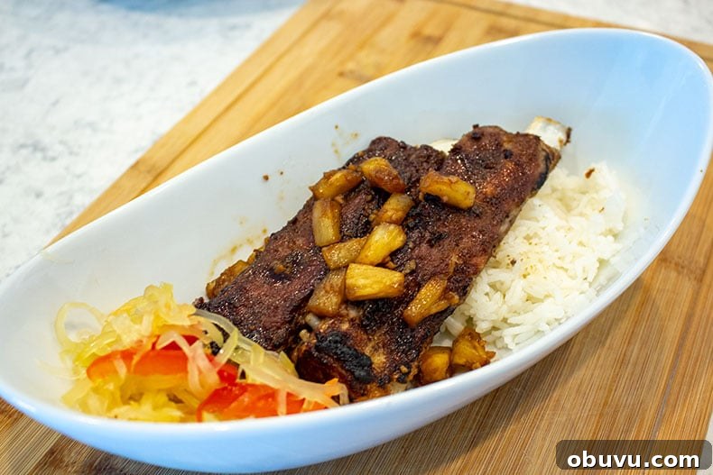 Sticky Korean-Style Spare Ribs Made in the Instant Pot 2 Instant Pot Pork Spare Ribs over white rice with atchara.