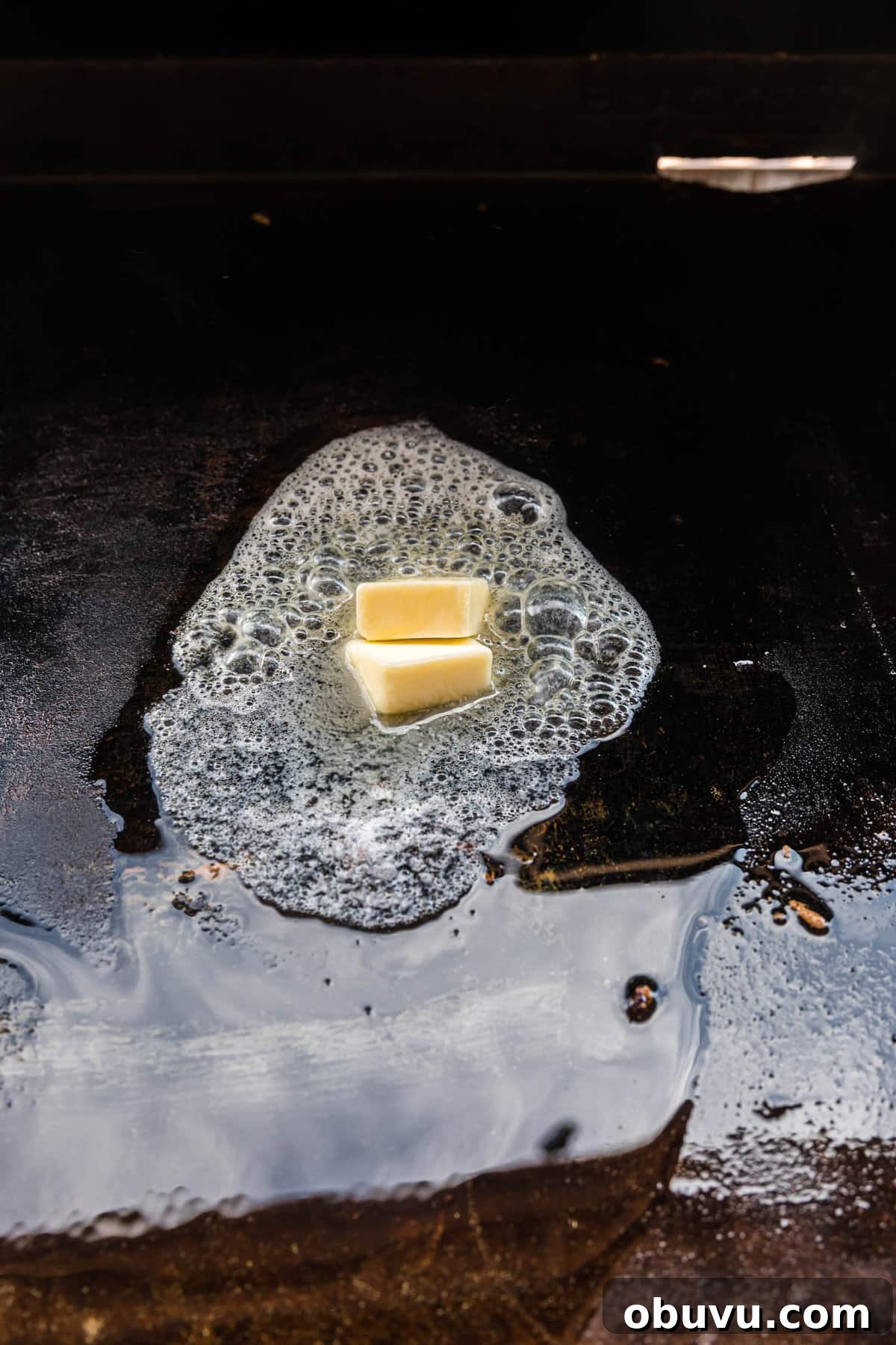 How to Make an Authentic Philly Cheesesteak on a Blackstone Griddle 4 Using butter to prepare the Blackstone for Philly Cheesesteak