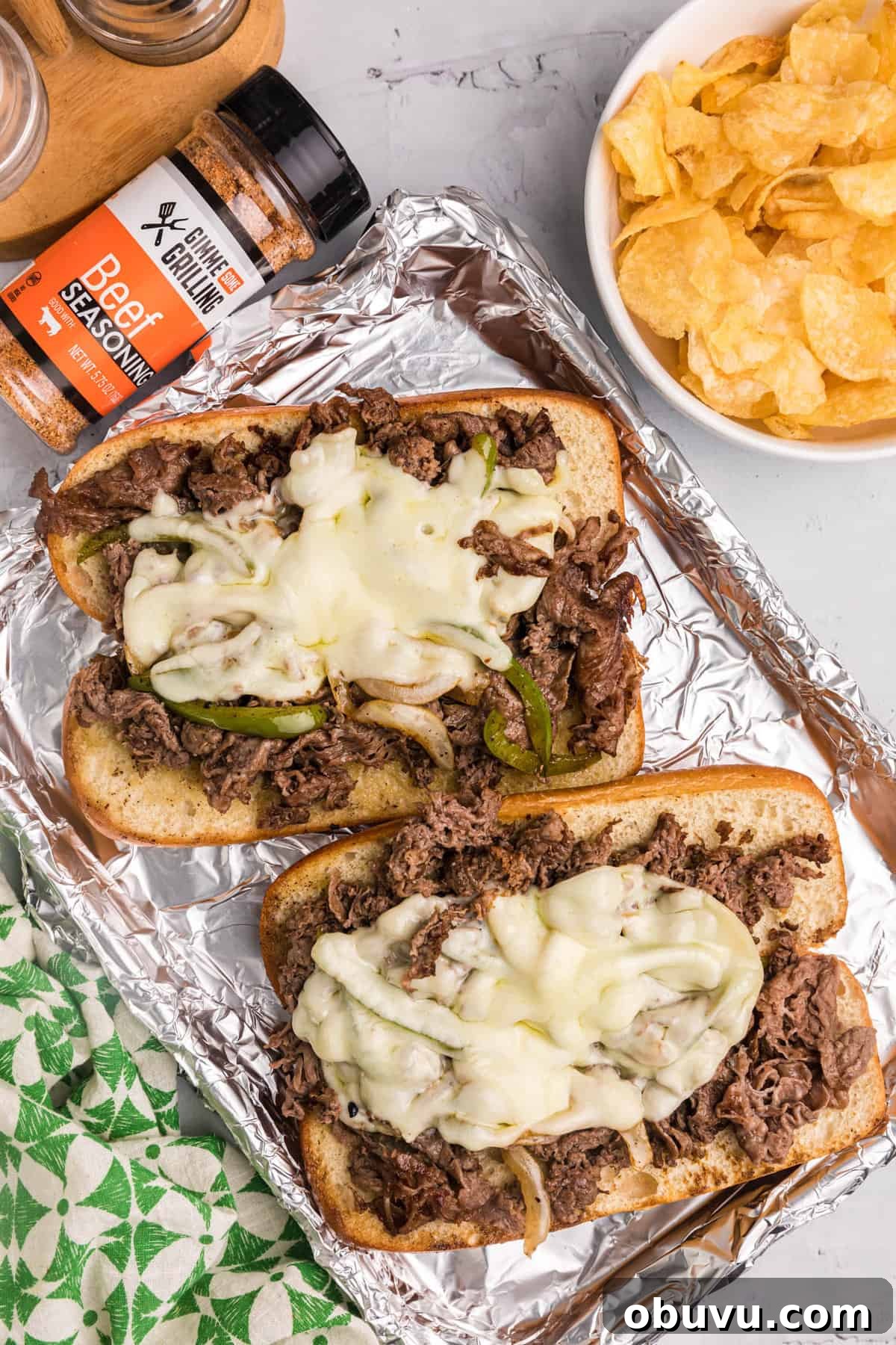 How to Make an Authentic Philly Cheesesteak on a Blackstone Griddle 9 Open faced cheesesteaks on tray