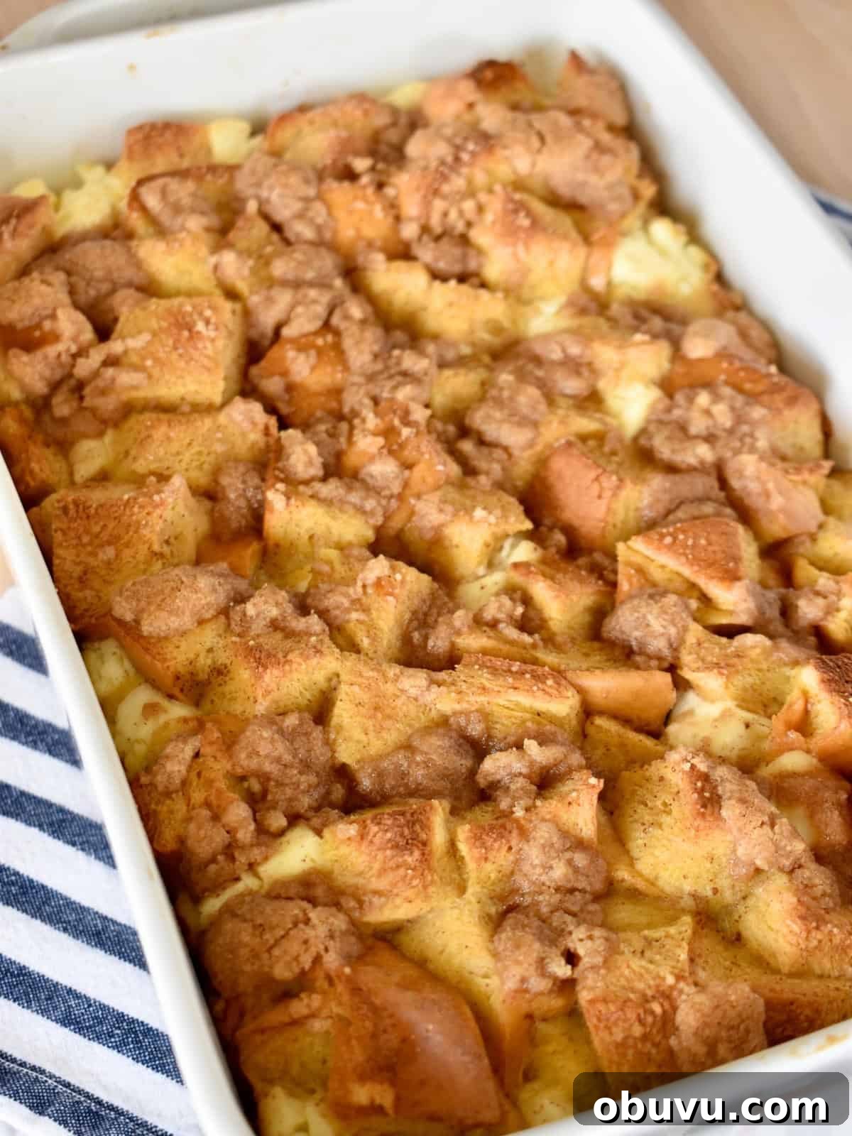 Cream Cheese Baked French Toast Casserole Recipe 2 Baked French Toast with Cream cheese casserole in a white baking dish.