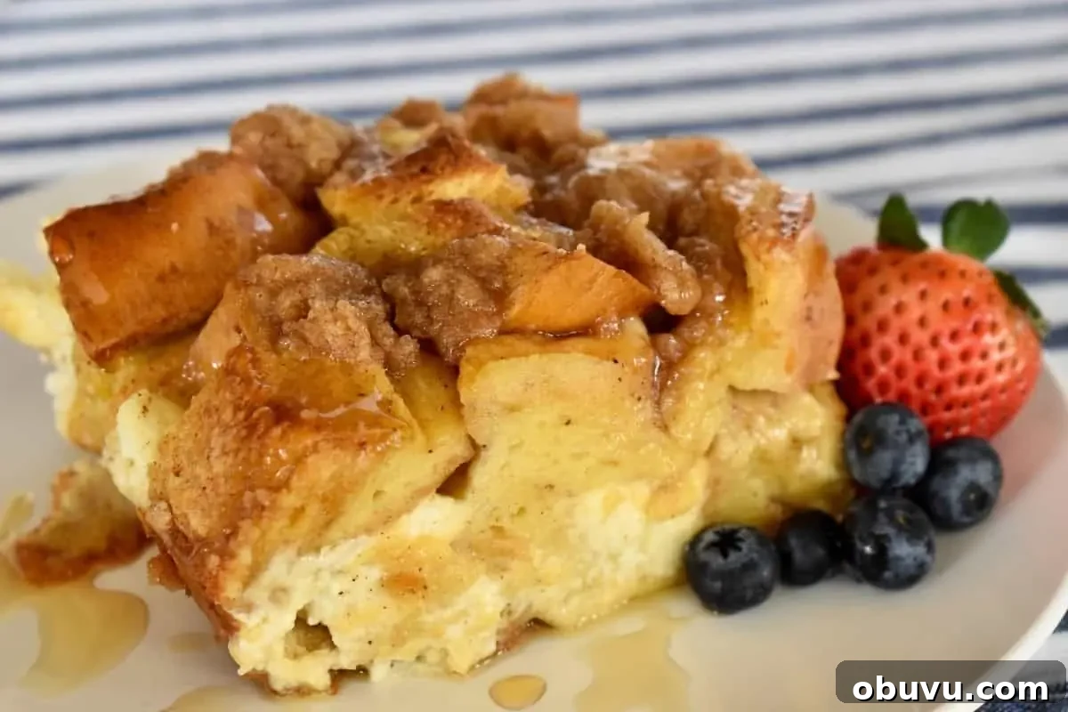 Cream Cheese Baked French Toast Casserole Recipe 3 Baked French Toast with Cream Cheese on a white plate.