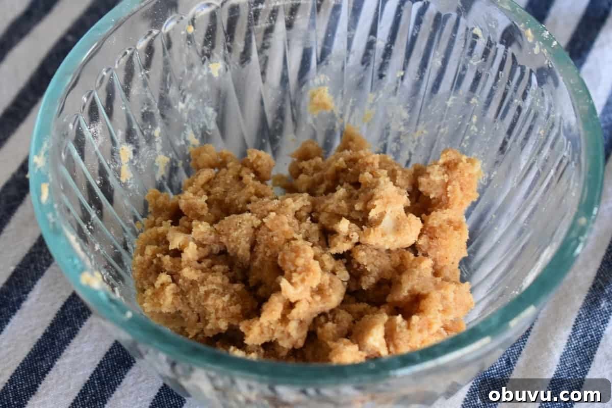 Cream Cheese Baked French Toast Casserole Recipe 8 Brown sugar, flour, and cinnamon crumb topping mixed together in a glass bowl.