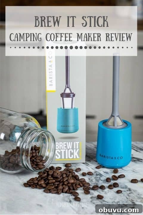 Brew It Stick Review — Is This the Ultimate Camping Coffee Maker? 2 grey and blue plastic camping coffee maker laid out on marble surface with coffee beans and glass jar