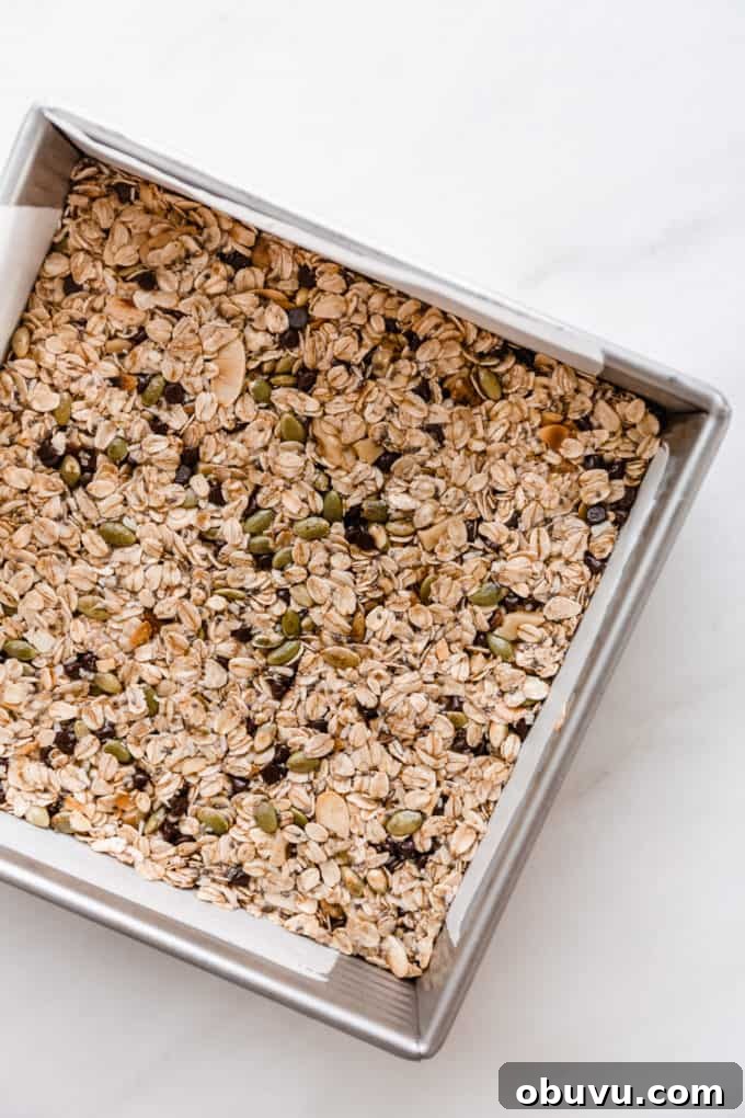 unbaked muesli bars in a square pan