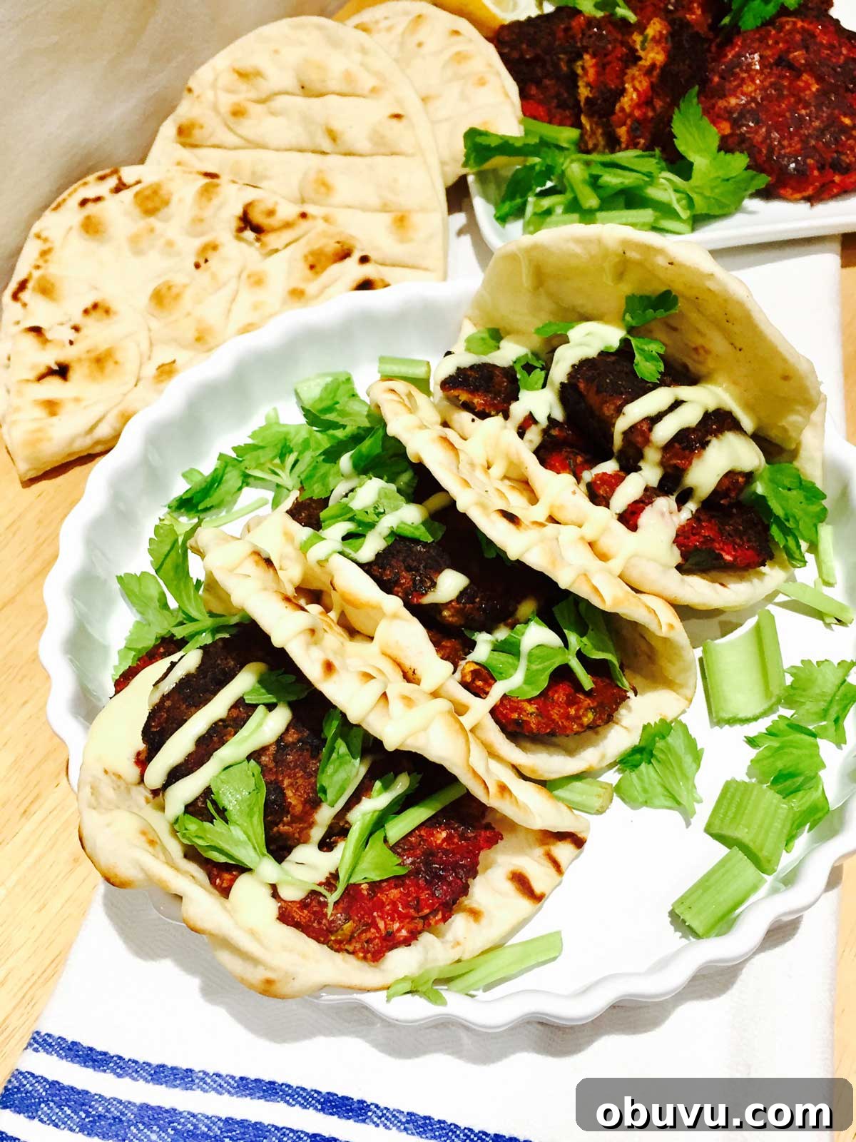 Beetroot and Halloumi Burgers on Flatbread with Tangy Slaw 2 Vegetarian beetroot and Halloumi cheese burger on pitta bread