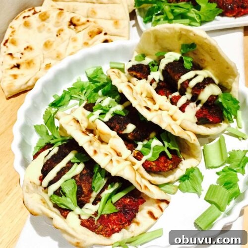 Beetroot and Halloumi Burgers on Flatbread with Tangy Slaw 3 Vegetarian beetroot and Halloumi cheese burger on pitta bread