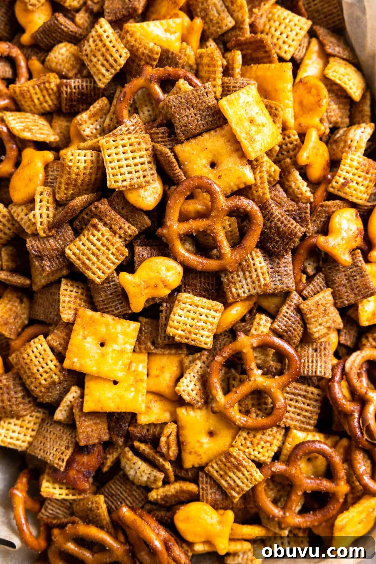 Texas Trash Spicy Chex Mix Recipe — Sweet, Smoky & Fiery 6 Up close view of Texas Trash loaded up with Chex cereals, pretzels, cheese cracker and goldfish.