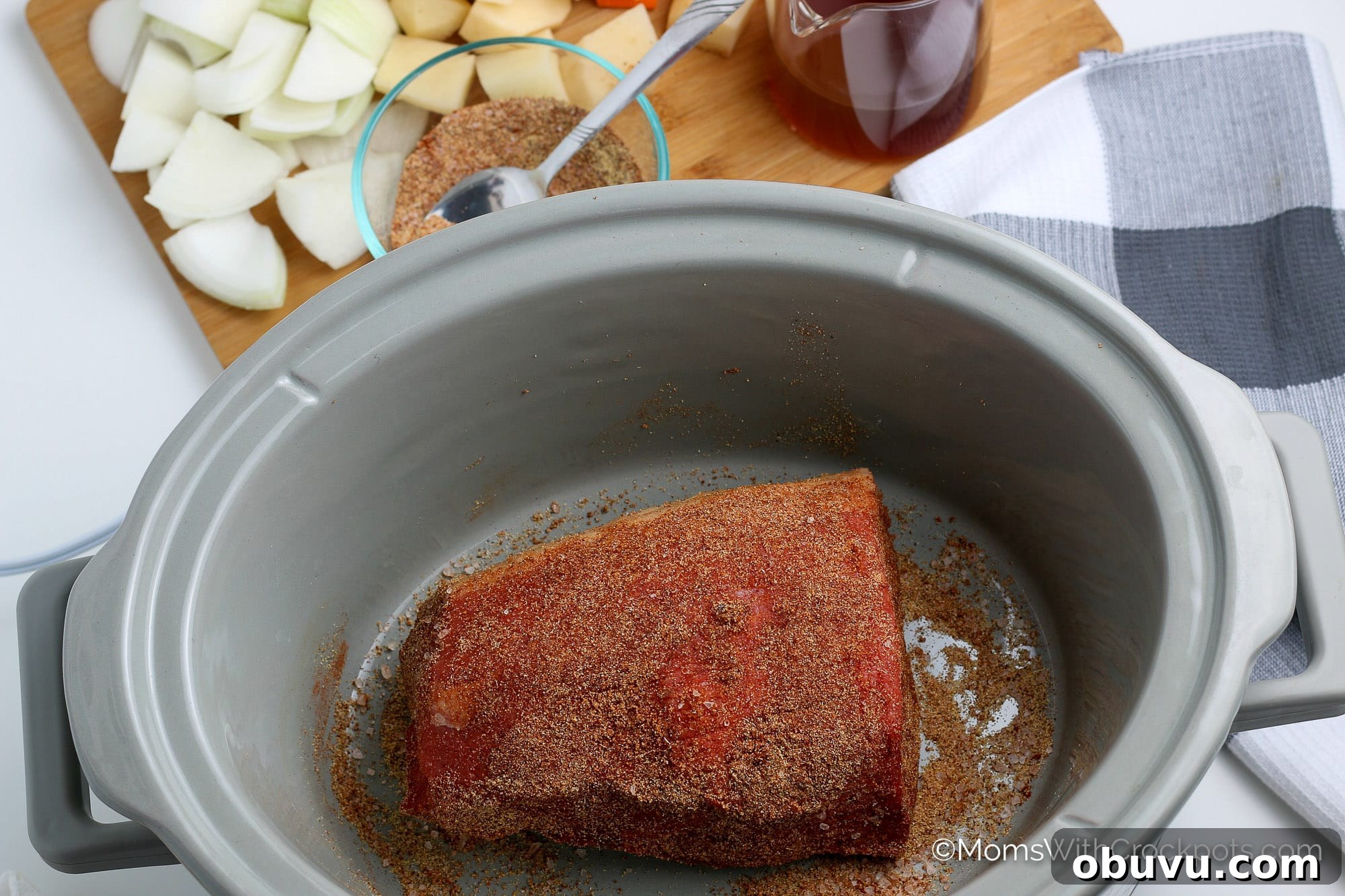 Tender Slow-Cooker Beef Roast with Garlic and Herbs 3 beef roast in crockpot with seasoning