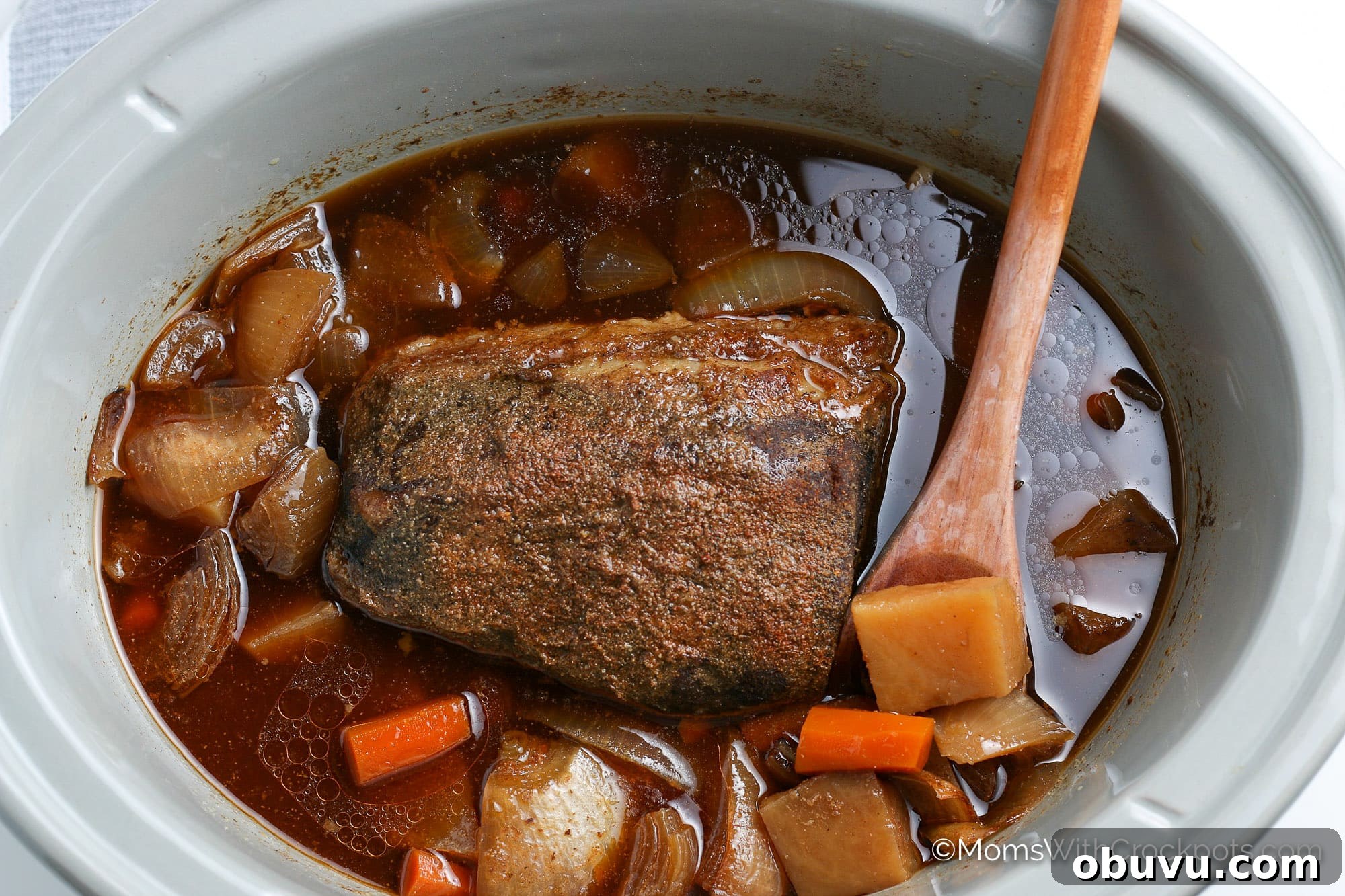 Tender Slow-Cooker Beef Roast with Garlic and Herbs 5 crock pot beef roast with veggies in slow cooker