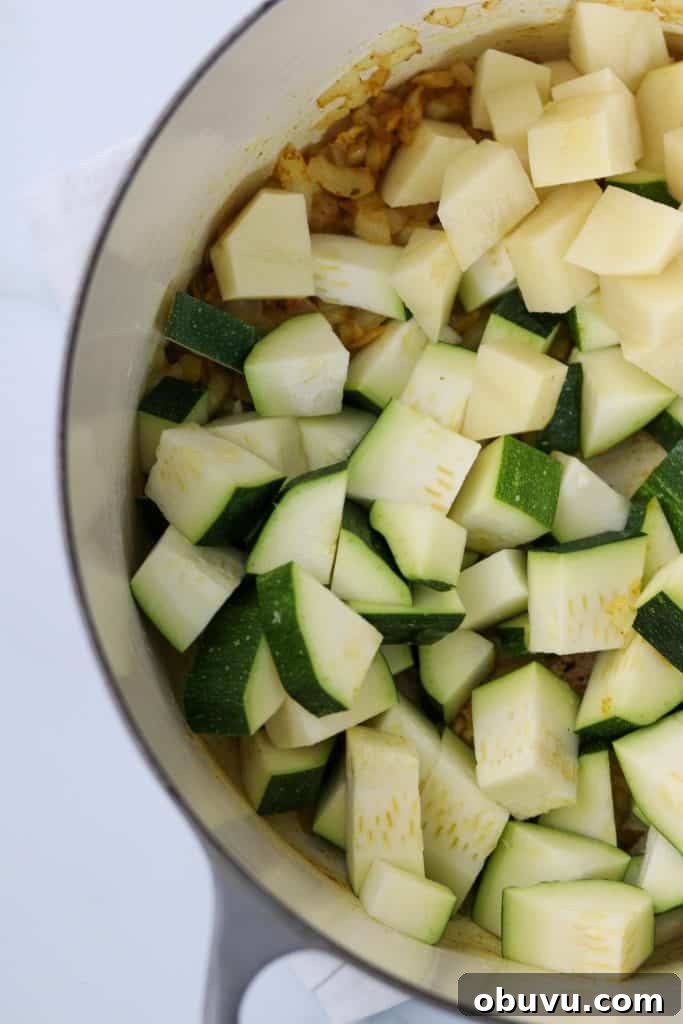 A close up of cut up zucchini and potato