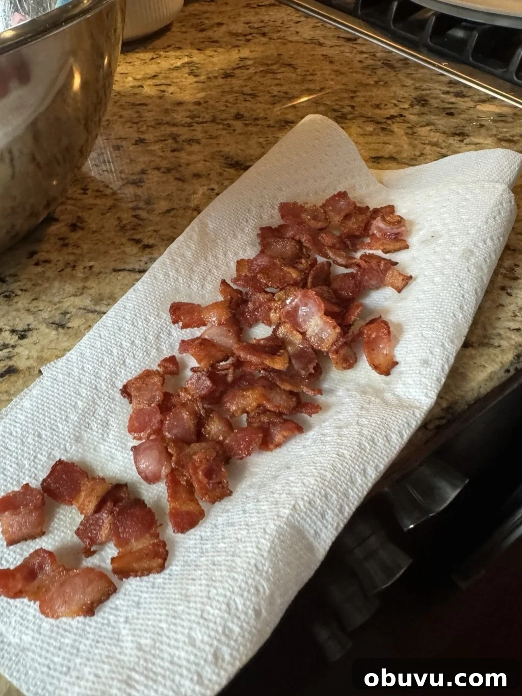Cauliflower Crunch Salad with Honey Jalapeño Dressing Recipe 6 Diced bacon on a paper towel on a kitchen counter